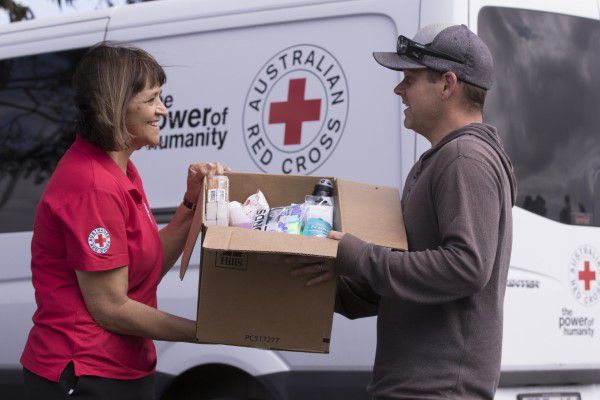 Red Cross volunteer accepting donations