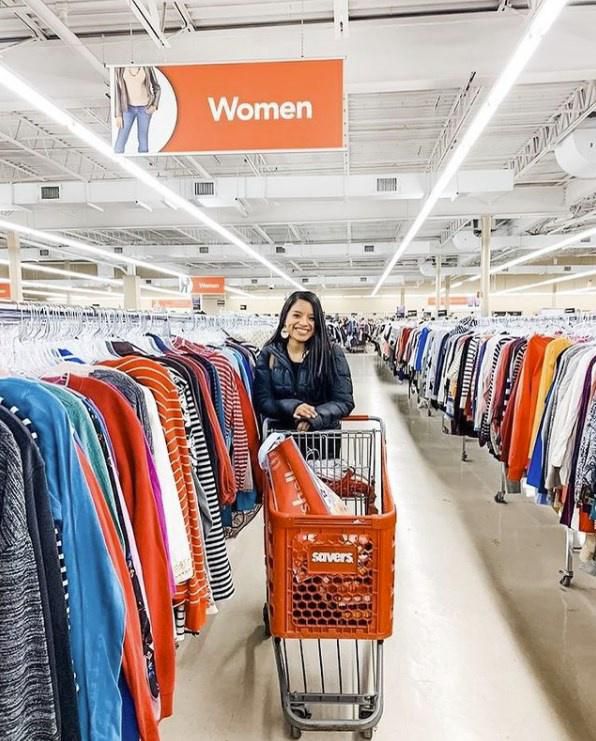 Woman shopping for donated clothes at Savers